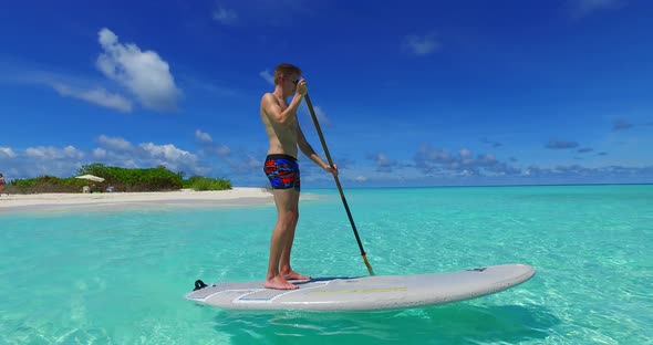 Happy man and woman on romantic honeymoon have fun on beach on white sand 4K background