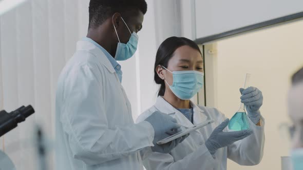 Two Scientists Working on Research in Lab