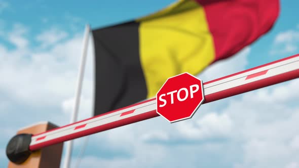 Barrier Gate Being Opened with Flag of Belgium As a Background alt