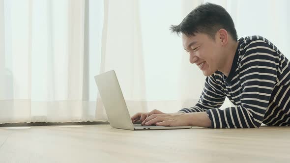 happiness peaceful smile asian male enjoy work from home quarantine  relax and positive work