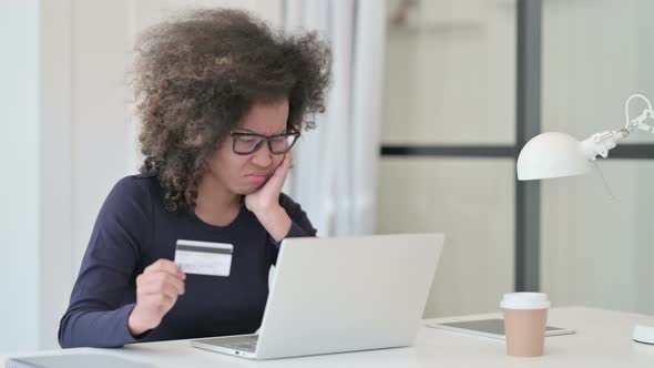 African Woman Upset By Online Payment Failure on Laptop