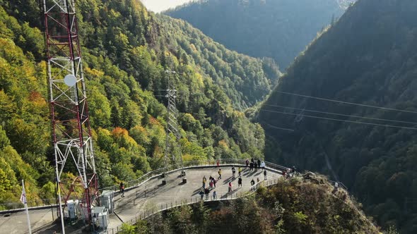 Aerial drone view of nature in Romania. Valley in Carpathian mountains with viewpoint full of people