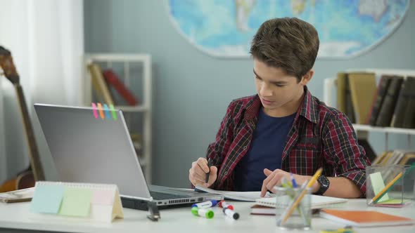 Smart Teenage Kid Diligently Doing Homework Tasks to Achieve Success in Future