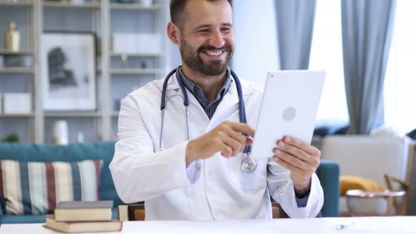 Doctor Sharing Good News on Video Chat on Tablet