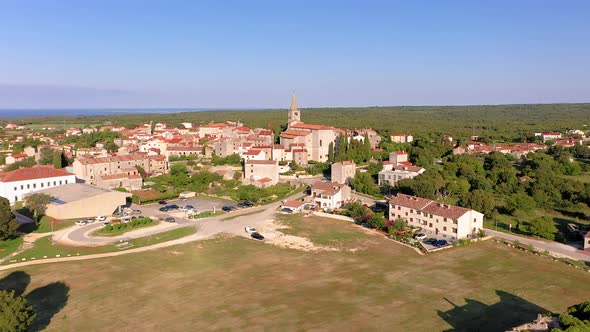 Flight over the historical town of Bale on the Istrian peninsula in Croatia at morning time