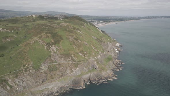 Bray Town Revealed Behind Bray Head Mountain Surrounded By Bright Blue Sea In Wicklow, Ireland. aeri