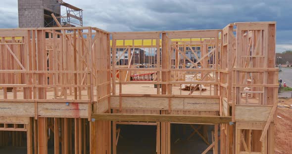 Framing of Under Construction Wooden House Building Frame Structure on New Development