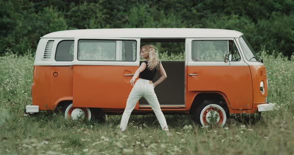 Girl Having Fun Dancing Infront of the Big Yellow