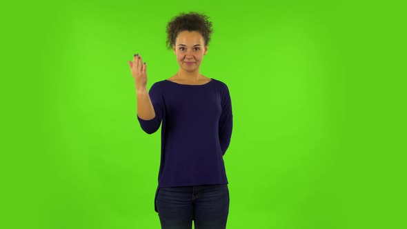 Curly Woman Waving Hand and Showing Gesture Come Here. Green Screen