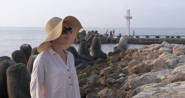 Lady Enjoy Sea Water on Shore