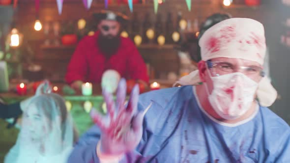 Man in Crazy Doctor Costume Dancing at a Halloween Party