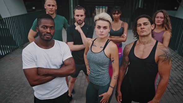 Close Up Outdoor Portrait of a Team of Active Attractive Men and Women in Sportswear