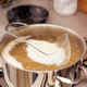 Pot of Broth Bouillon Boils on an Electric Stove
