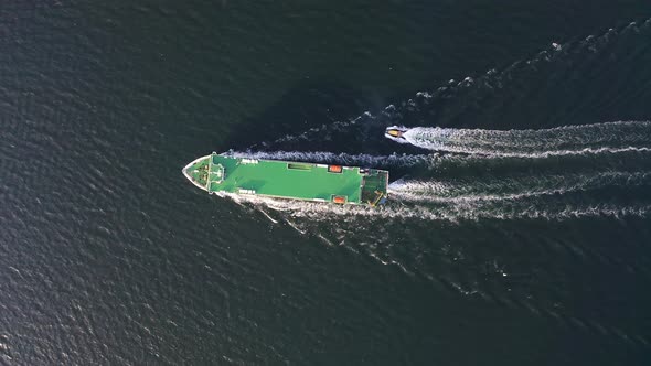 Large Car Ferry RoRo with a Pilot Boat