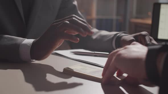 Close Up of Hands of Afro-American Businessman Refusing to Take a Bribe