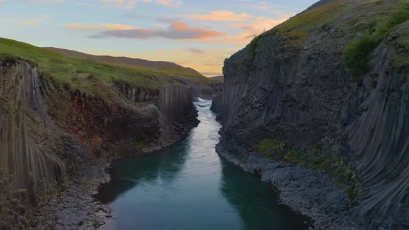 Flying Through the Studlagil Canyon in East Iceland at Sunset