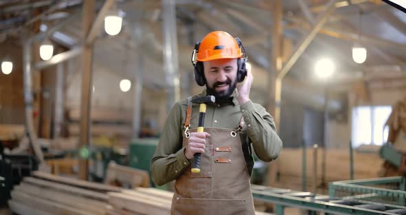 Carpentry Worker Having Fun at the Factory