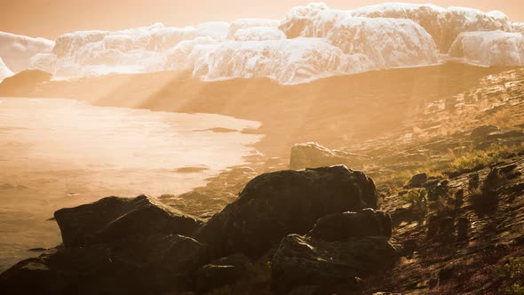 Antarctic Icebergs Near Rocky Beach