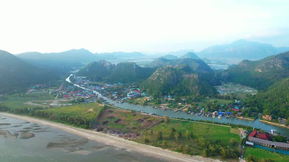 A fishing village amidst the beautiful coastline of Thailand. Mountains on the coast of the sea.