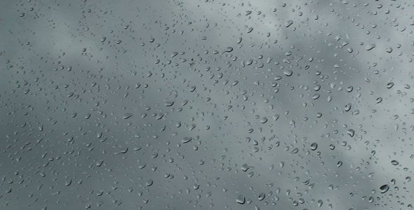 Cloudy Sky Behind Wet Glass