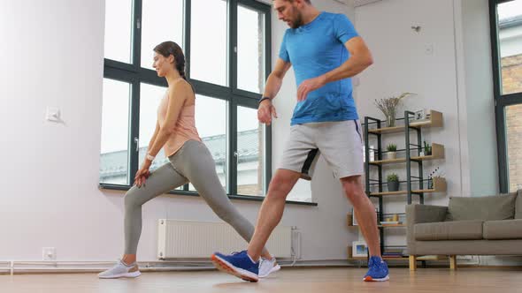 Couple Exercising and Doing Lunge at Home