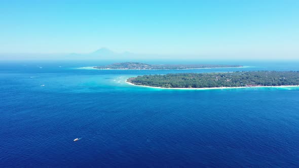 Vibrant blue and aqua waters off the coastline of the beautiful paradise island of Bali