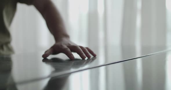 Close View of Male Hand Runs Over an Old Piano and Wipes the Dust