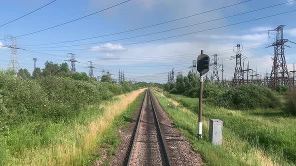 Blured Side View of Highspeed Turning End Back of Train on Landscape of Beautiful Nature Wild Field