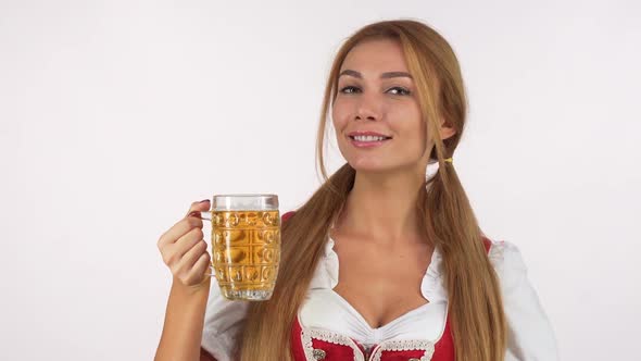 Gorgeous Happy Bavarian Woman Enjoying Smelling Delicious Beer