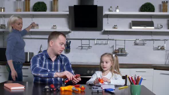 Dad with Cute Girl at Shop Class in Domestic Kitchen