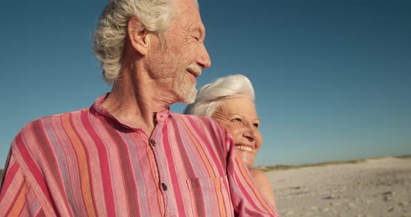 Senior couple enjoying free time at the beach