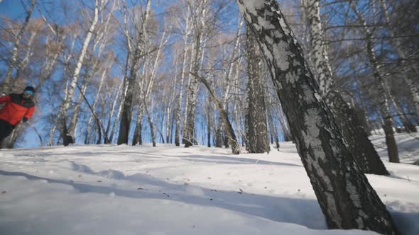 Man Running at the Mountain with Snow