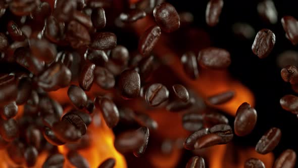 Super Slow Motion Shot of Flames and Coffee Beans Explosion on Black Background at 1000Fps