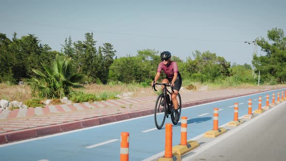 Woman cycling on bicycle lane
