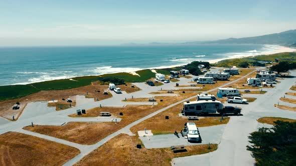 Aerial View Fly Camping Zone for Cars on Wheels on the Shore of the Pacific Ocean