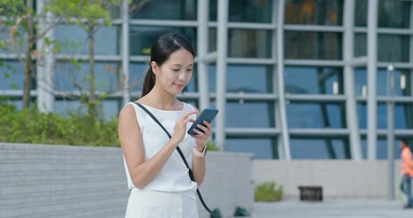 Woman use of mobile phone in Hong Kong city
