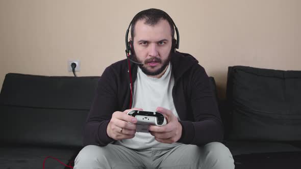 Angry Man Gamer with Headset Play Online Team Video Game, Live Streaming