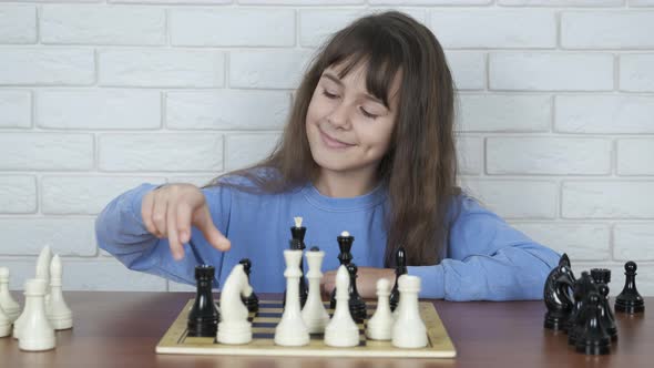 A girl plays an intellectual game. 