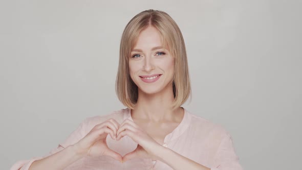 Studio portrait of young, beautiful and natural blond woman.