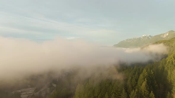 Aerial panoramic view of Sea to Sky Highway near Horseshoe Bay during a sunny winter evening before