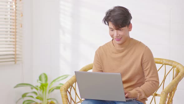 Entrepreneur handsome business asian man wear casual working online on couch smile