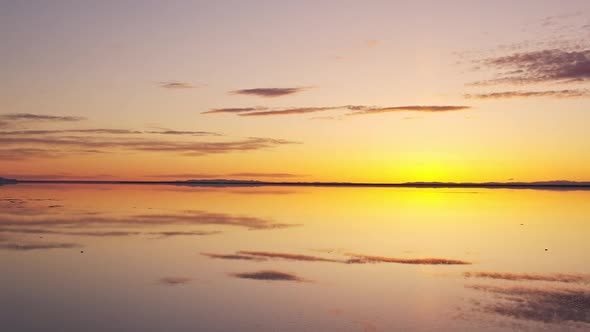 Panning over the Great Salt Lake reflecting a colorful sky