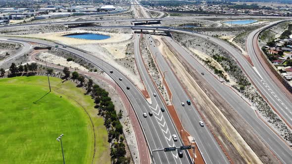 Aerial View of a Busy Freeway near an Oval in Australia