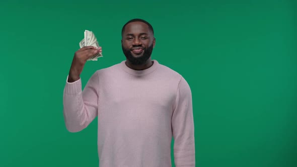 Satisfied Rich Funny Africanamerican Man Showing Money Smiling Pleased and Show Standing with