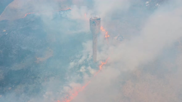 Aerial View of a Natural Disaster - Burning Grass, Air Pollution, Smoke Over a Fire