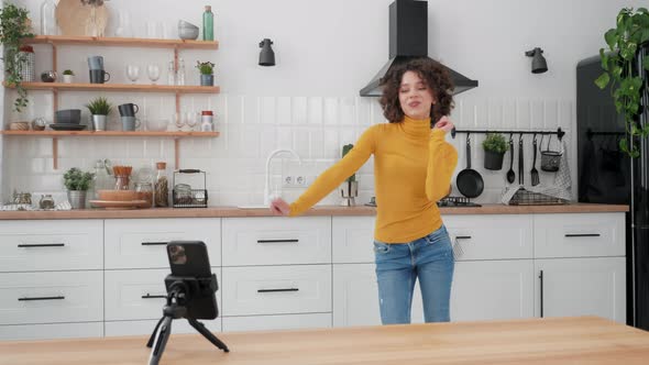 Woman Blogger Dancing on Smartphone Camera Recording Video for Social Media