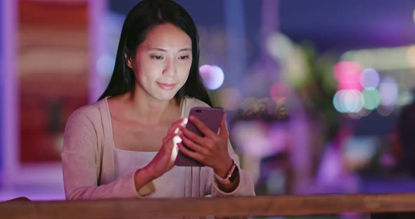 Woman use of mobile phone in coffee shop