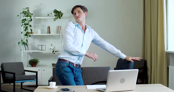 Funny Active Office Worker Freelance Joker Dancing in Workplace at Lunchtime, Having Party at Home