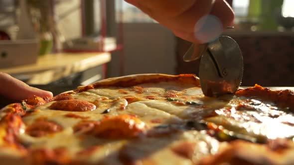 Slicing Up Pizza with Restaurant Bakery Knife