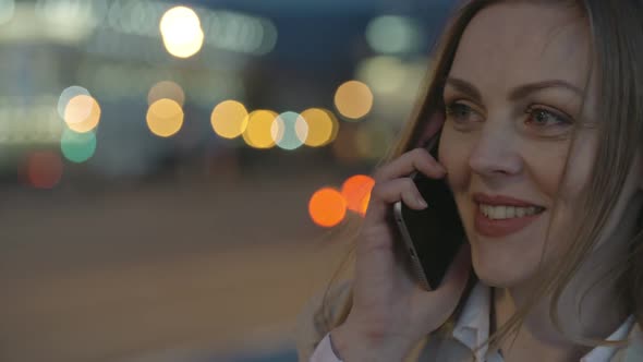 Beautiful Woman Speaking on the Phone